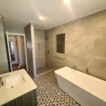 Modern bathroom with tub and walk-in shower