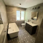 Modern bathroom with tub and vanity
