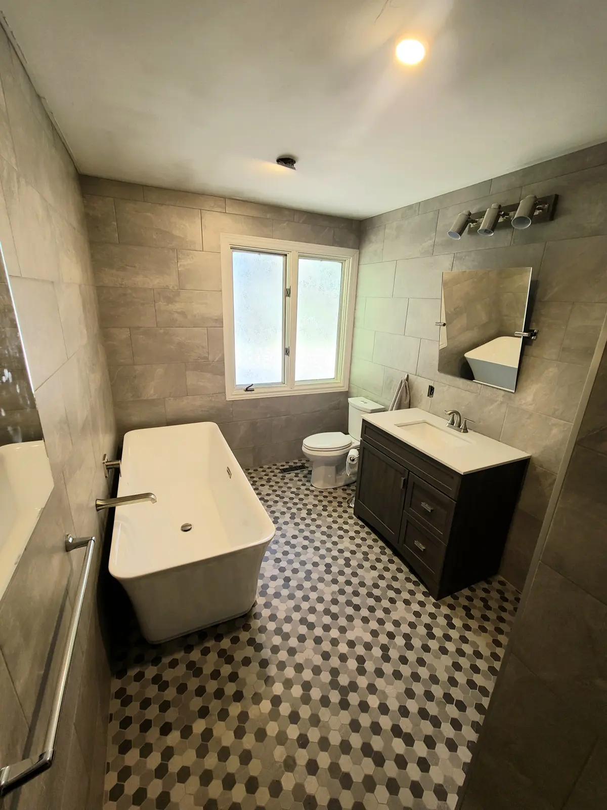 Modern bathroom with tub and vanity