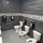 Restroom with standard and child-size toilets.