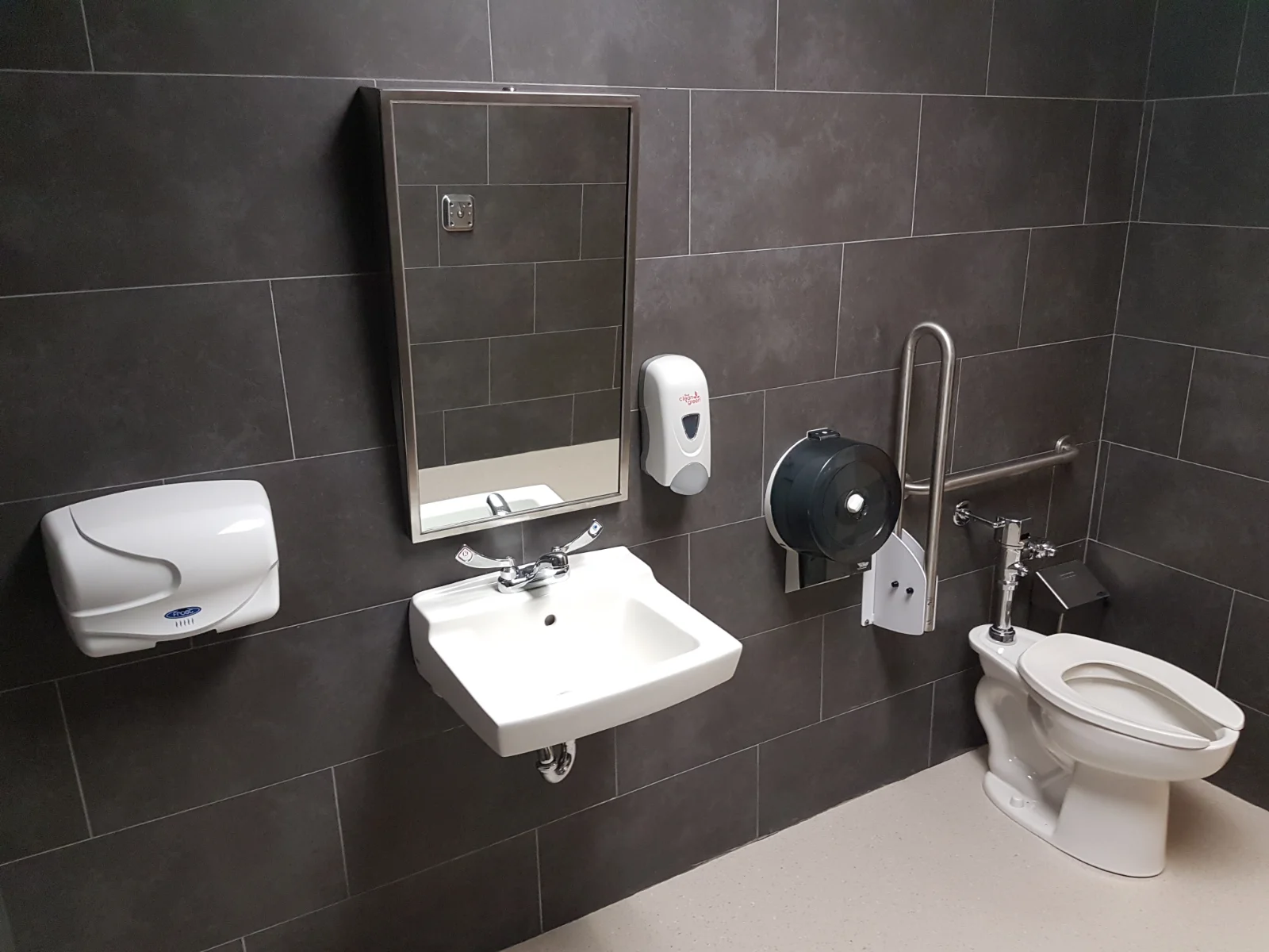 Accessible restroom with sink and toilet facilities.