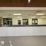 Empty reception area with Canadian flag visible.