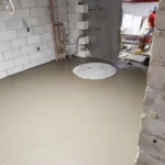 Freshly poured concrete floor in construction site.