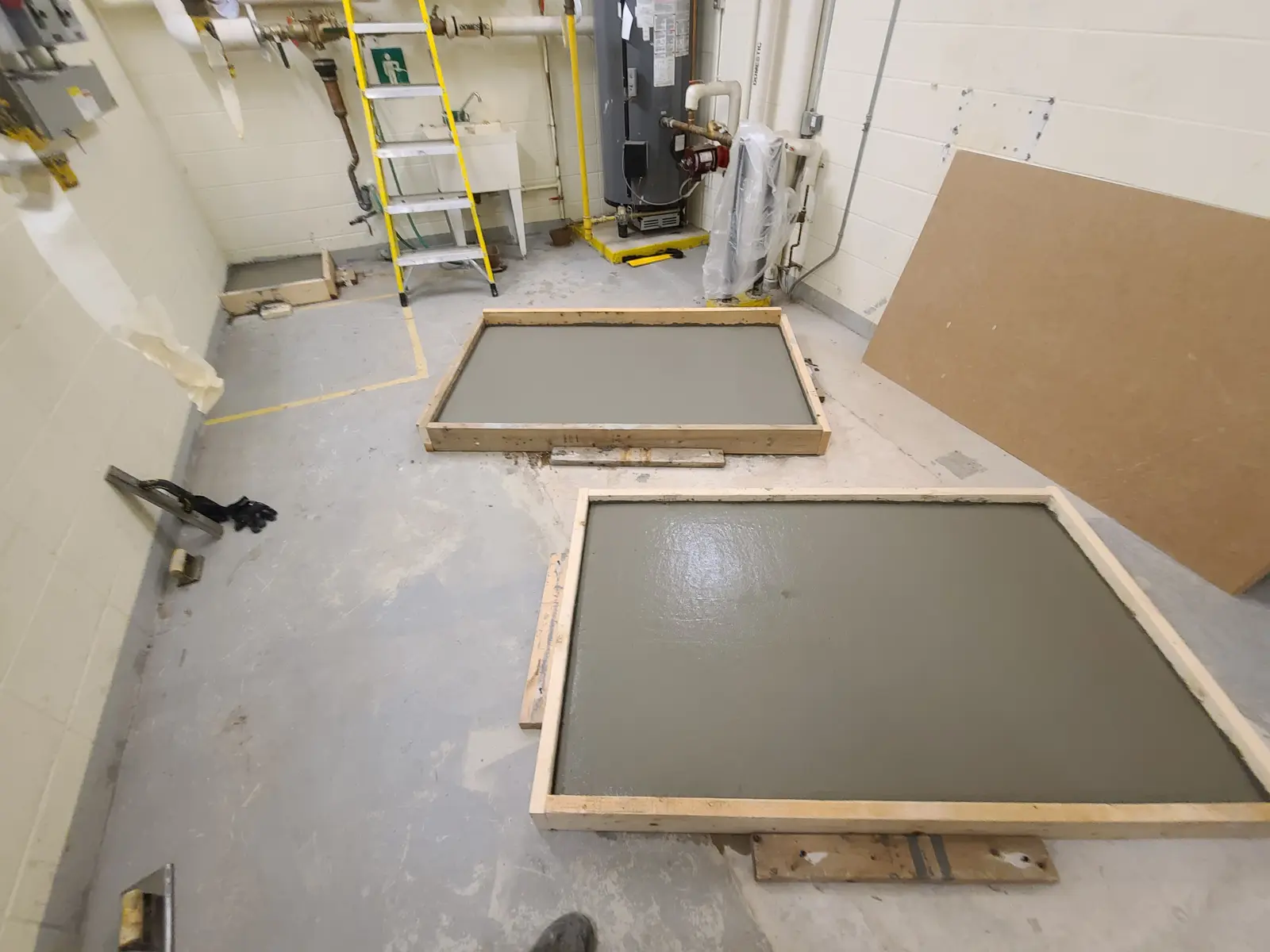 Fresh concrete slabs in utility room