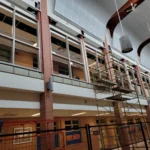Scaffolding inside a large building under renovation.